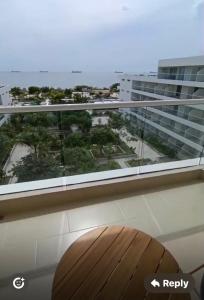 a balcony with a view of a large building at Santa Martha-Apartment- Ocean view in Mirabel