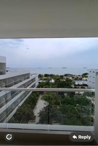 a view of the ocean from a balcony of a building at Santa Martha-Apartment- Ocean view in Mirabel +2 photos