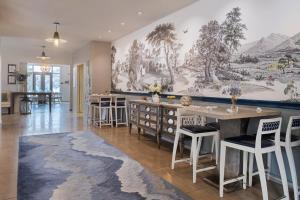 a living room with a large mural on the wall at Hotel Indigo Old Town Alexandria by IHG in Alexandria