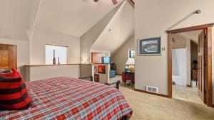 a bedroom with a large bed and a staircase at The Buckeye in Red Lodge +20 photos