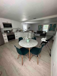 a kitchen and living room with a table and chairs at Cozy Apartment in Brownsville