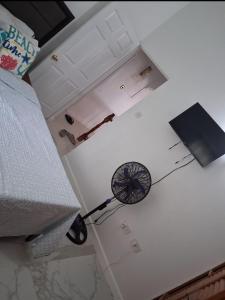 a fan on the floor of a room at Nyack's Palace And Boutique in Beaulieu