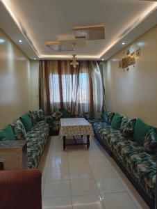 a living room with a couch and a table at الصخيرات in Skhirat
