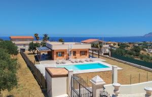 an aerial view of a house with a swimming pool at Cozy Home In Balestrate With Wifi in Balestrate
