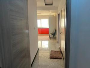 a hallway with a door leading to a room at Adja Adama sow in Dakar