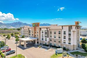 an image of a hotel with a parking lot at Holiday Inn Express & Suites Salt Lake City South-Murray by IHG in Murray