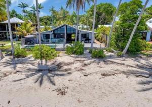an image of a house on the beach at Boonooloo on Absolute Beachfront in Newell Beach