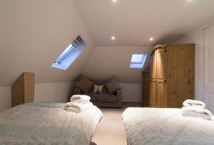מיטה או מיטות בחדר ב-Blair Drummond Holiday Home