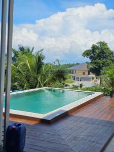 a swimming pool on the deck of a house at Anda Sea view in Klong Muang Beach