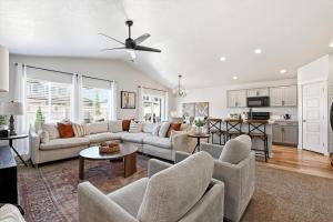 a living room with a couch and a table at Mineral Spa Fire Pit Game Room Mini Split AC in Meridian