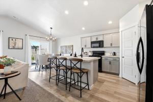 a kitchen and living room with a table and chairs at Mineral Spa Fire Pit Game Room Mini Split AC in Meridian