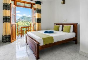 a bedroom with a bed and a large window at Onestar Ella in Ella