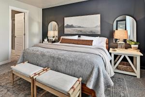 a bedroom with a large bed and two mirrors at Mineral Spa Fire Pit Game Room Mini Split AC in Meridian +46 photos