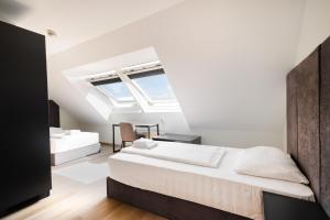 a bedroom with two beds and a window at Lenas Donau Hotel in Vienna +67 photos