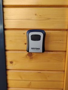 a black and white toaster on a wooden wall at Parenthèse et spa à deux pas de la place Stanislas in Malzéville