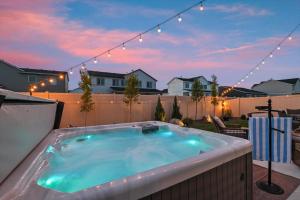 a jacuzzi tub on the back of a backyard at Mineral Spa Fire Pit Game Room Mini Split AC in Meridian