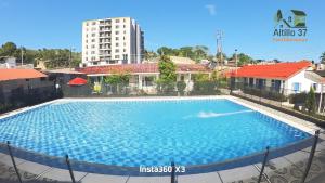 a large swimming pool in the middle of a building at Melgar-Tolima-Apartaestudio in Melgar