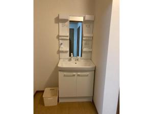 a bathroom with a sink and a mirror at base sanablend - Vacation STAY 39607v in Kyotango