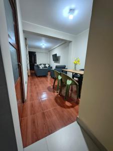 a living room with a couch and a table at Esencia de Altura Hostal in El Tambo +1 photo