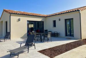 a patio with a table and chairs on it at Résidence Le Petit Duc in Carcassonne +36 photos