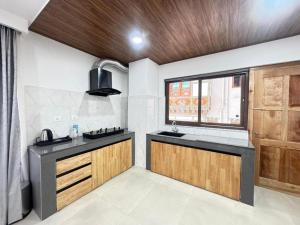 a kitchen with a sink and a window at HB Apartment in Thimphu in Thimphu