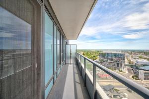 a balcony of a building with a view of the city at Cozy Condo in Downtown KW in Kitchener