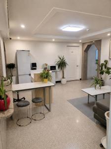 an office with two tables and potted plants at New Star Hotel in Chu-sung