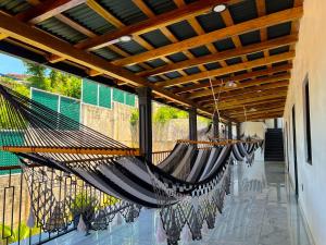 a hammock hanging from awning on a patio at La Casona Suchitoto in Suchitoto