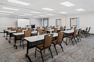a classroom with tables and chairs in a room at Hyatt House Boston/Burlington in Burlington +41 photos