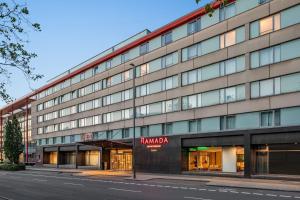 a building on a street next to a street at Ramada by Wyndham Essen in Essen +92 photos