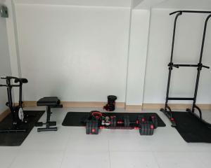 a room with two treadmills and two exercise machines at Casa Amul in Tigbawan