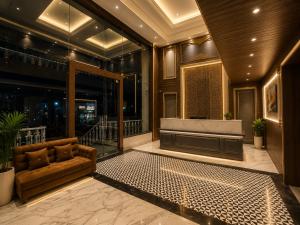 a lobby with a couch and a tub in a building at Hotel Next View Amritsar # Pool # Parking # Family Hotel # Best choice for Tourists in Amritsar