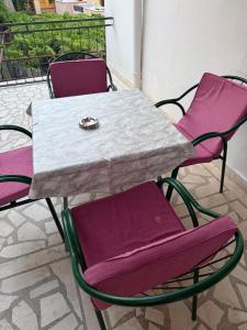a table and chairs with a engagement ring on top at Guest House Plima 2 in Budva +59 photos
