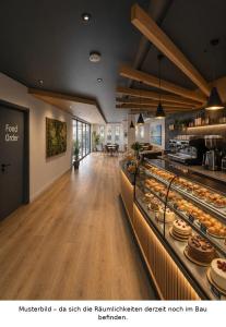 ein Restaurant mit einem Buffet aus Gebäckstücken in der Unterkunft HelloStay Zug Studios in Hünenberg