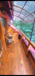 a view of the inside of a boat with a table at Над Річкою in Yaremche