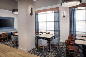a conference room with tables and chairs and a tv at Hyatt Place Dublin/Pleasanton in Dublin