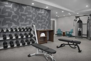 a gym with two exercise bikes and a wall at Home2 Suites by Hilton Florida City in Florida City
