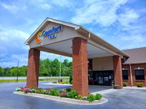 a building with a cardinals inn sign on it at Comfort Inn near Downtown & Blue Ridge PKWY in Marion