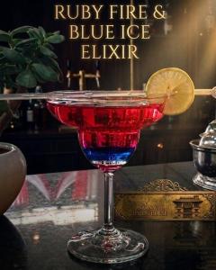 a red and blue drink in a glass on a table at Anamnagar Union House in Kathmandu