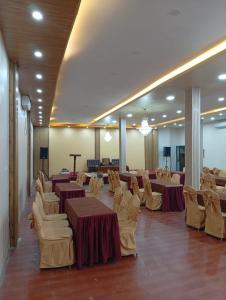 a banquet hall with tables and chairs in a room at Anamnagar Union House in Kathmandu