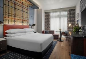 a hotel room with a bed and a desk at Canopy By Hilton Deer Valley in Park City