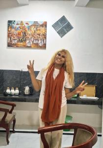 a woman standing in front of a counter at Kandy Jungle Border in Kandy