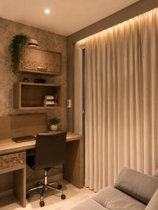 a home office with a desk and a chair at Comfortable Serviced Apartment by the Lake in Brasília +16 photos