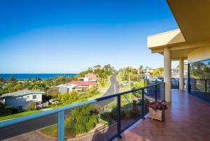 a balcony with a view of the ocean at Kyeema in Tathra