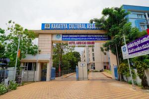 a school building with a sign that reads kolkata cultural institute at Open Hotel by Olive - Ambicas Grand in Visakhapatnam