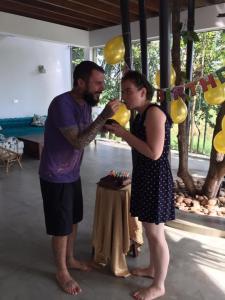 a man feeding a woman a piece of cake at 47 - Your Ultimate Relaxation in Colombo in Pannipitiya