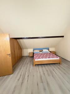a small bedroom with a bed in a attic at Villa Eden Prijecani in Banja Luka