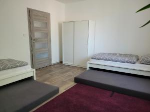 a room with two beds and a closet at Apartment u Ježků in Sebranice +52 photos