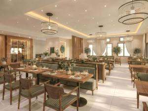 a restaurant with wooden tables and chairs and windows at LEOLIA Nautical Resort Kala Nera - Handwritten Collection in Volos