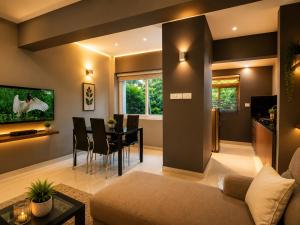 a living room with a couch and a table at Transit Suites by GrandWest in Nedumbassery